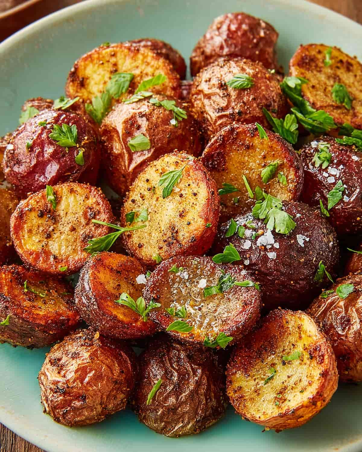 Air Fryer Red Potatoes seasoned to perfection, garnished with fresh parsley.