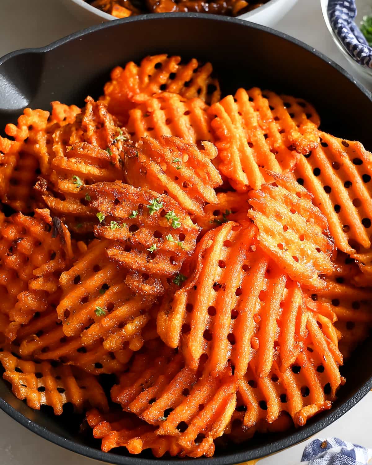 Alexia waffle cut sweet potato fries air fryer with crispy edges and golden-brown color.