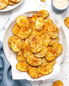 Crispy Air Fryer Potato Chips piled in a bowl with golden edges and crackly texture, ready to snack on