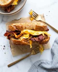 Air Fryer Bacon Egg And Cheese Sandwich with crispy bacon, melted cheddar, and toasted bread, ready in 10 minutes